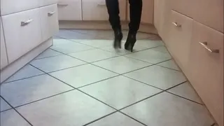 vacuuming in the Kitchen with black ankle boots