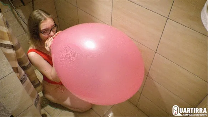 Q607 Kira blows to pop 20'' balloon in a shower