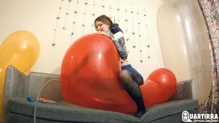 Q511 Ava rides and pumps big heart shaped balloons to pop