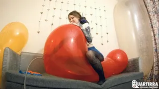 Q511 Ava rides and pumps big heart shaped balloons to pop