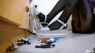 Q417 Ava crushes toy cars with high platform sandals