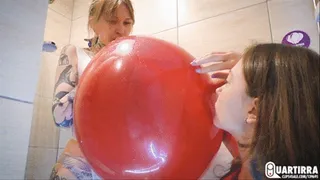 Q100 Ava and Leya blow to pop balloons in shower