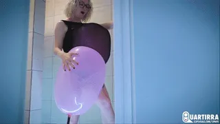 Q101 Lilu pumps a balloon in her swimsuit with a foot pump in shower