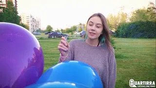 Q212 Leya pops my balloons with a cigarette outdoors