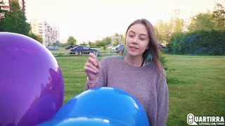 Q212 Leya pops my balloons with a cigarette outdoors