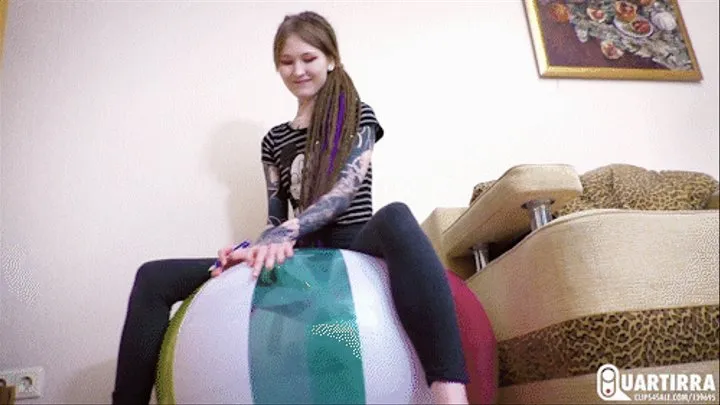 Q638 Ava rides big beachball and pops it with pen