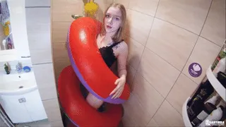 Q577 Kira takes shower with an inflatable Sea Serpent