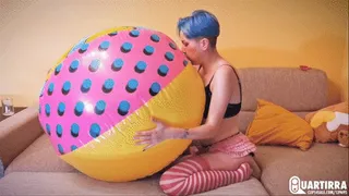 Q777 Stashia blows, rides and deflates big colorful beachball