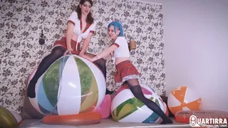 Q903 Cosette and Stashia ride and pump to pop two big Rainbow beachballs