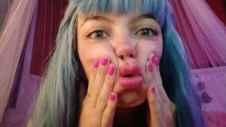 Cute girl squeezes her face making fishy lips