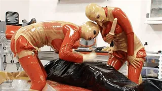 Two latex goddess and the slave catheterised in inflatable rubber - Part 2 of 2 - The catheter and the piss