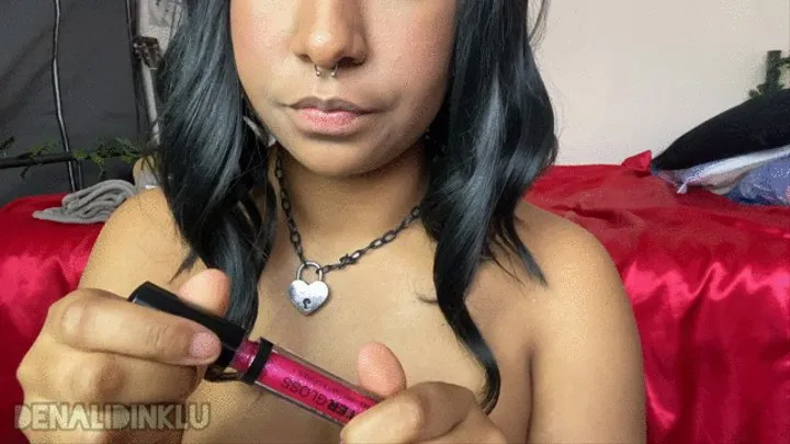 Applying Shiny Pink Lipgloss