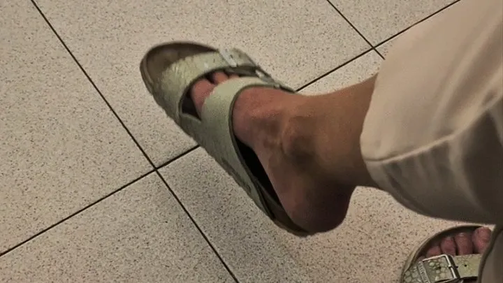 Really dangling birkenstock slippers in doctor's office