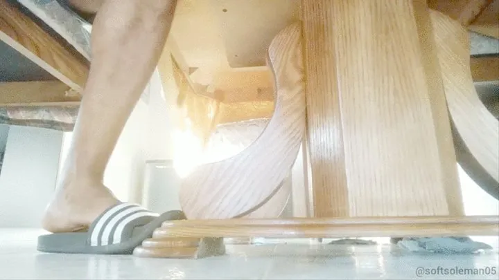 My feet under the table, in side angle POV (2019)