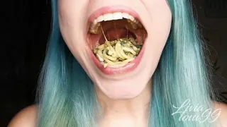 Spinach spaghetti open mouth chewing