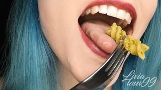 Chewing pasta with pesto genovese
