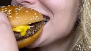 Quarter pounder burger, fries and coke chewing