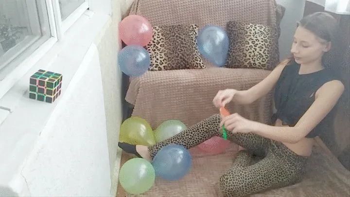 Girl blows up four balloons in a row