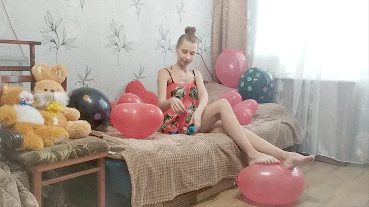 Girl inflates balloons in the form of funny