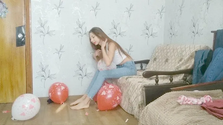 Girl popping booty balloons