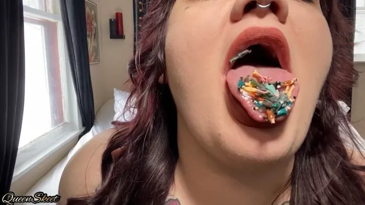 Giantess eats handful of tiny people for snack vore