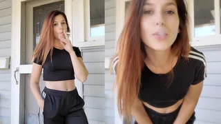 Sporty Girl Having a Smoke on the Porch