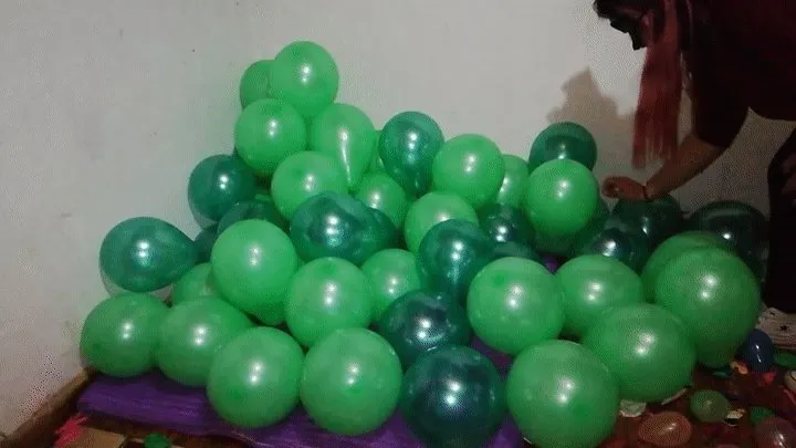 Mass popping green balloons