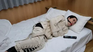 Watching TV in Bondage; Japanese Girl in Canvas Straitjacket and Leg Binder and Ball Gag Watches TV