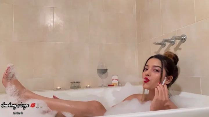 Relaxing bathtub smoking Marlboro red and drinking