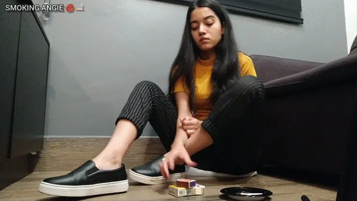 Casual girl smoking in dirty sneakers