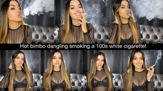 Hot bimbo dangling smoking a 100s white cigarette!