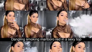 Dangling smoking marlboro red in a sexy low cut top, ponytail, hoops and nude glossy lips!