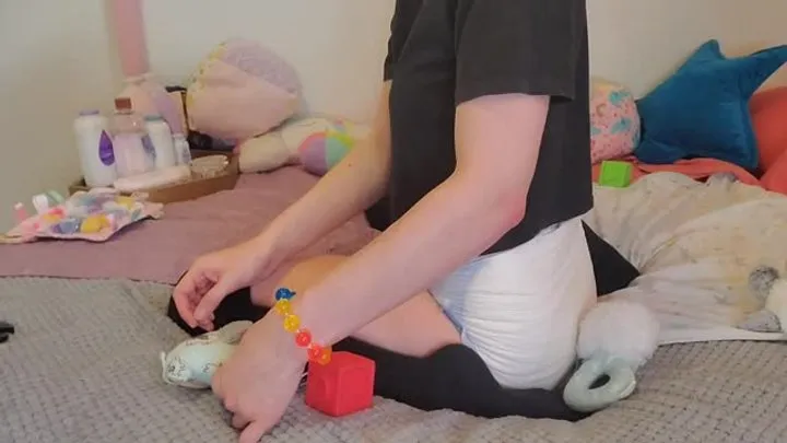 Wet Diaper Girl Plays With Toys