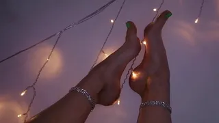 Feet in glowing garlands!