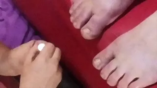 Lady Lillie paints Bunelle's toes long cut