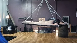 Flogged on a dungeon hammock