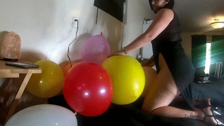 unedited popping balloons side view