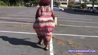 Chocolate Pear walking outside in a tight dress