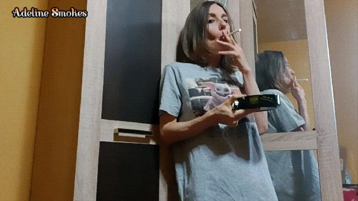 Smoking a cigarette in a long t-shirt