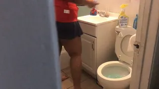 chubby girl gives the bathroom a good scrubbing
