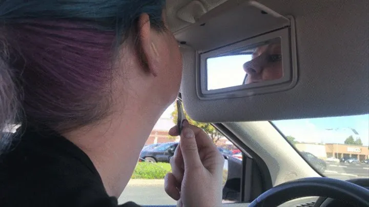 babe pulling chin hairs in a parked car