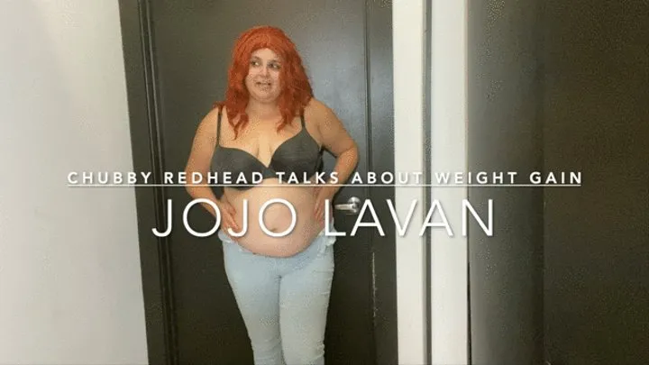 Red head examines belly and talks about weight gain