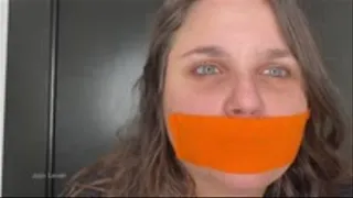 Gag talk with orange bondage tape on my small lips