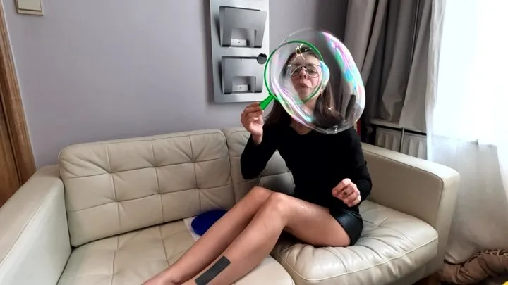 Blowing giant bubbles in a short skirt