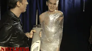 Nicky is captured and completely wrapped in plastic wrap