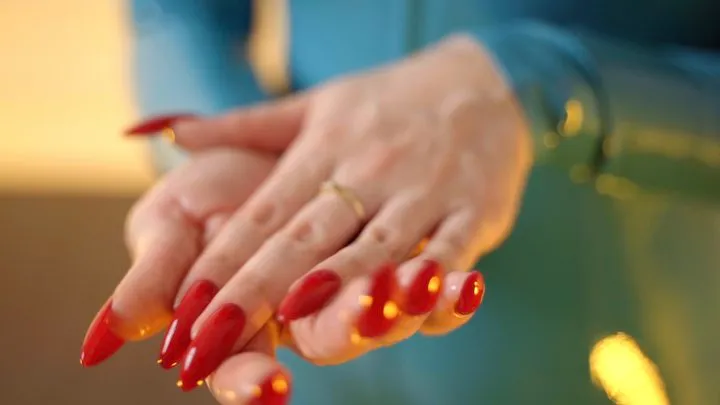 Long red nails and latex