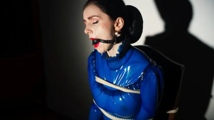 Goddess in latex blouse tied with ropes