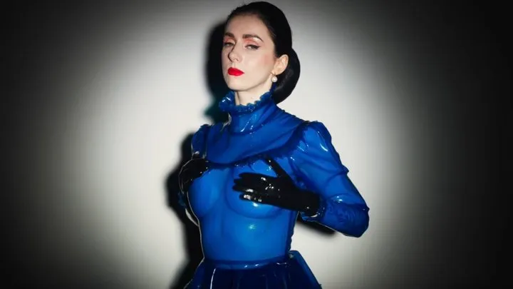 Seductive sound of a blue latex blouse