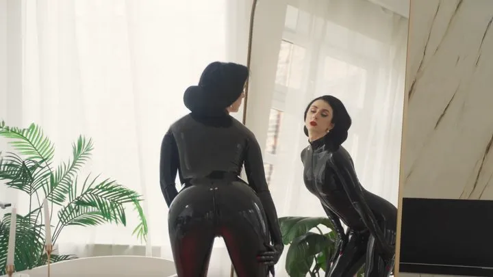 Mistress enjoys her latex in the mirror