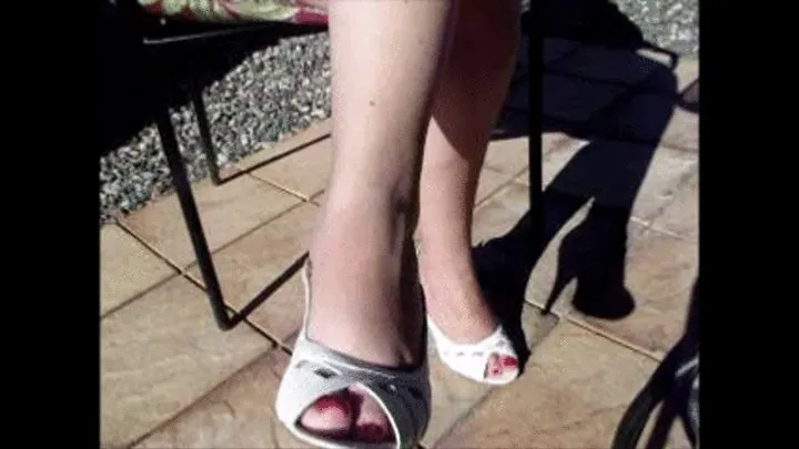 Deb Teasing on the Patio at Winery in Sedona Dangling & Dipping White Bandolino Pumps with Black Skirt